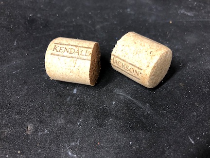 Take your standard wine cork and cut it in half with a sharp razor knife. This will let you easily make plugs for both sides from a single cork. Of course, if you want to have different corks, you can do that to. It doesn't really matter.