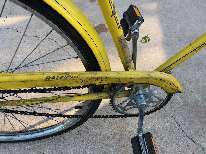 The battered chainguard appeared to be held on mostly with grime, and that three-speed cable may be past its prime. The decal style places it somewhere in the mid-70s, probably.