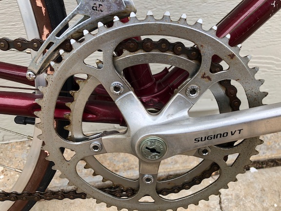 Drivetrain is pretty-typical for a bike in this price range from that era: Sugino cranks, Suntour AR II derailleurs. The steel chainrings are a disappointing. They'll clean up, but they were clearly a cost-cutting move.