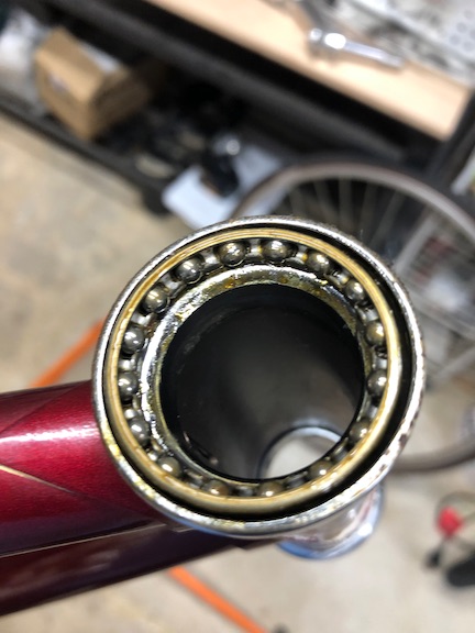 The headset bearings (and all the other bearings) were pretty varnished up. Clearly, years in a hot garage took a toll.